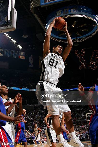 Tim Duncan of the San Antonio Spurs pulls down a rebound against the Detroit Pistons in Game Six of the 2005 NBA Finals on June 21, 2005 at SBC...