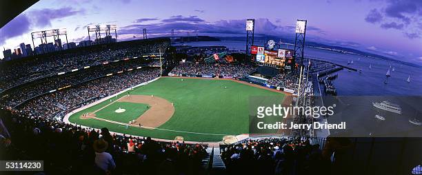 Panoramic view of SBC Park from the right field upper level at sunset with the San Francisco bay in the background during a game between the...