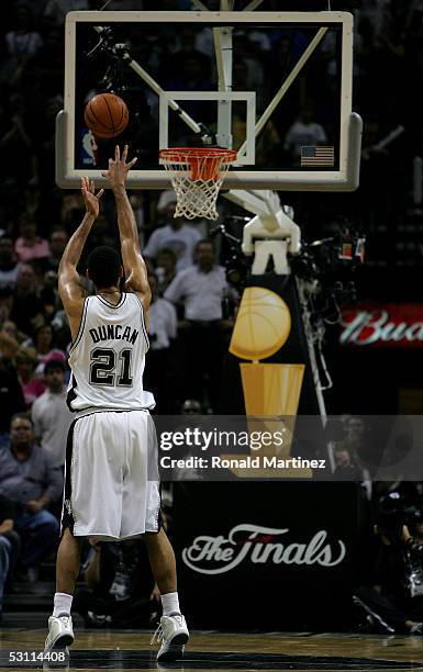 Tim Duncan of the San Antonio Spurs shoots a free throw in the final moments of the Spurs' loss to the Detroit Pistons in Game six of the 2005 NBA...