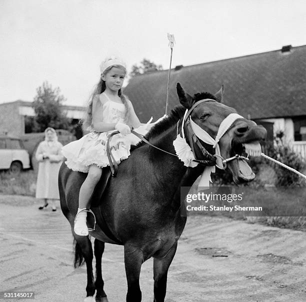 Young competitors await the judges decision at the Whitstable Carnival, Kent, 13th August 1958.