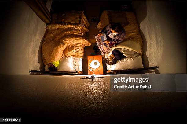grandma telling a night tale to grandsons at home. - child asleep in bedroom at night stock pictures, royalty-free photos & images