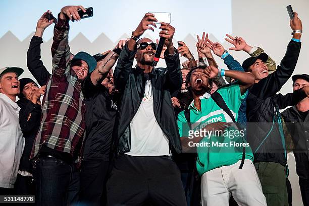 Snoop Dogg takes a selfie with fans at the premiere of Adidas' "Away Days" at The Orpheum Theatre on May 12, 2016 in Los Angeles, California.