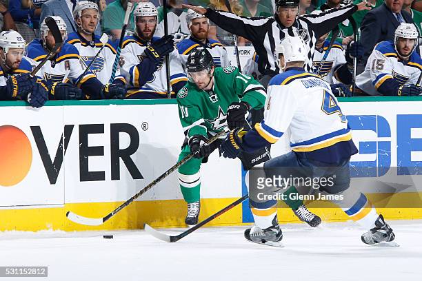 Patrick Sharp of the Dallas Stars handles the puck against Carl Gunnarsson of the St. Louis Blues in Game Five of the Western Conference Second Round...