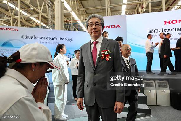 Somkid Jatusripitak, Thailand's deputy prime minister, poses for a photograph during the opening ceremony of the new Honda Motor Co. Assembly plant...
