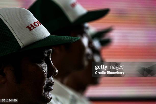 Employees attend the opening ceremony of the new Honda Motor Co. Assembly plant in Prachinburi, Prachinburi Province, Thailand, on Thursday, May 12,...