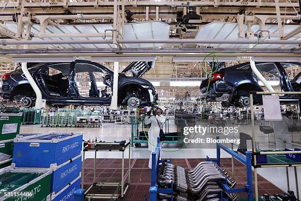 Employees assemble Honda Civic vehicles on the production line of the Honda Motor Co. Assembly plant in Prachinburi, Prachinburi Province, Thailand,...