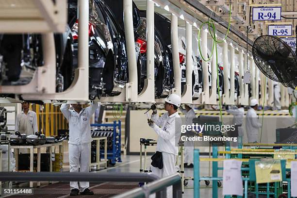 Employees work on Honda Civic vehicles on the production line of the Honda Motor Co. Assembly plant in Prachinburi, Prachinburi Province, Thailand,...