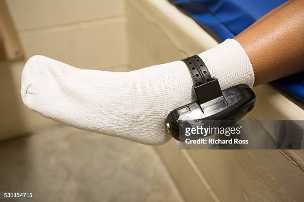 teen showing ankle monitor - ankle monitor stock pictures, royalty-free photos & images