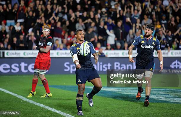 Waisake Naholo of the Highlanders celebrates scoring a try during the round twelve Super Rugby match between the Highlanders and the Crusaders at...