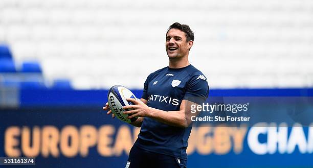 Dan Carter of Racing shares a joke with team mates during the Racing 92 Captain's Run ahead of the European Rugby Champions Cup Final against...