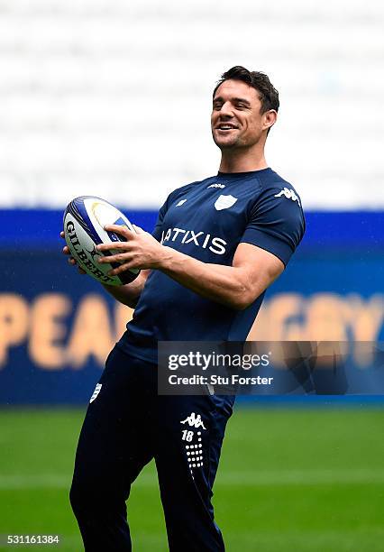 Dan Carter of Racing shares a joke with team mates during the Racing 92 Captain's Run ahead of the European Rugby Champions Cup Final against...