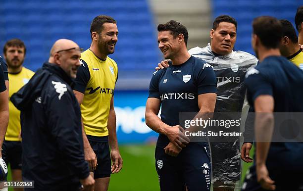 Dan Carter of Racing shares a joke with team mates during the Racing 92 Captain's Run ahead of the European Rugby Champions Cup Final against...