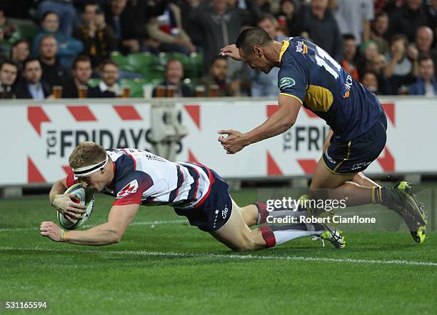 Reece Hodge of the Rebels scores a try during the round 12 Super Rugby match between the Rebels and the Brumbies at AAMI Park on May 13, 2016 in...