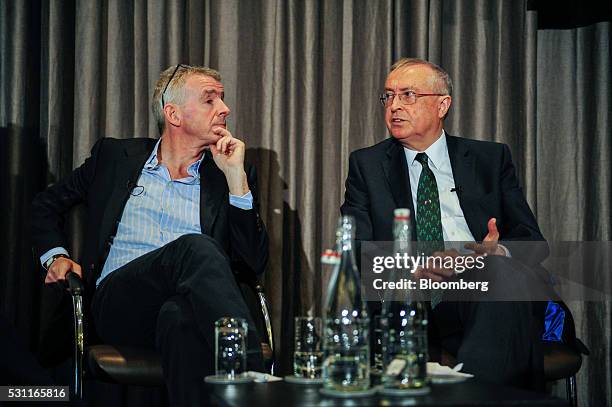 Michael O'Leary, chief executive officer of Ryanair Holdings Plc, left, looks on as Richard Pym, chairman of Allied Irish Banks Plc, speaks during a...