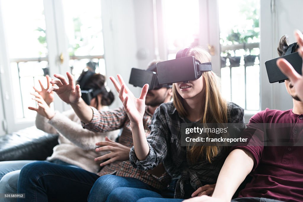 Friends addicted to the VR simulator togetherness
