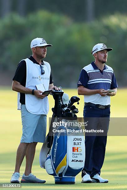 Jonas Blixt of Sweden and caddie Bill Harke prepare to play a shot on the 11th hole during the second round of THE PLAYERS Championship at the...