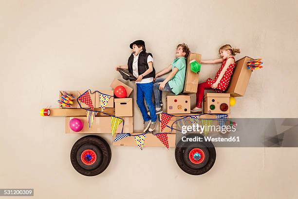 kids driving to party, having fun - boy playing with cars stock pictures, royalty-free photos & images