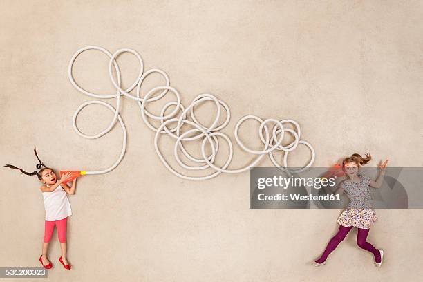 children trying out tin can telephone - tin can phone stock pictures, royalty-free photos & images