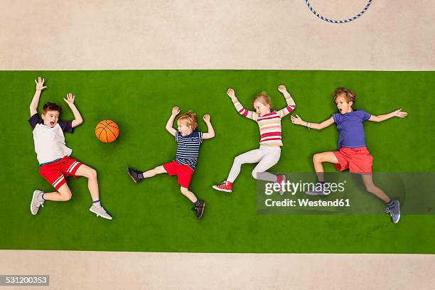 children playing soccer in park - 6 football player stock-fotos und bilder