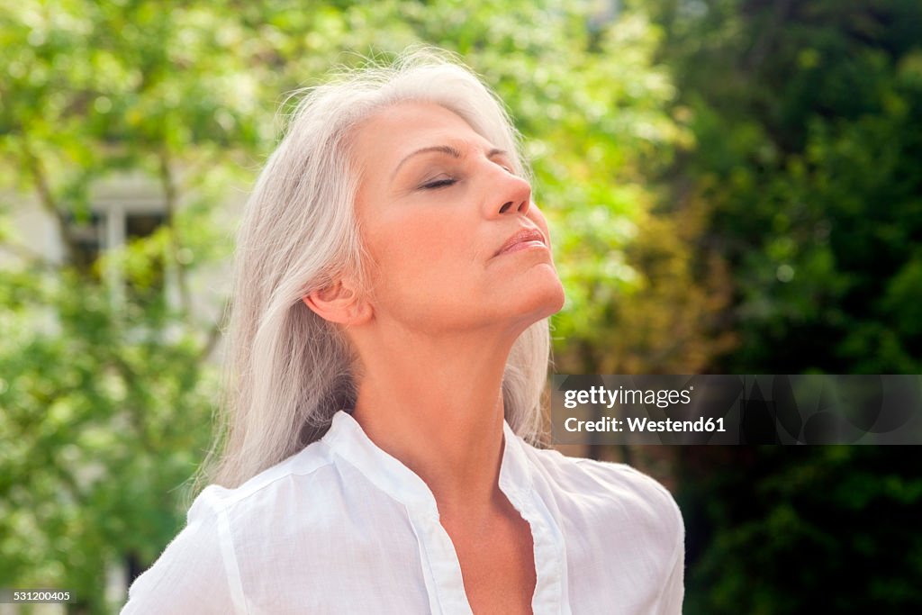 Portrait of mature woman enjoying fresh air