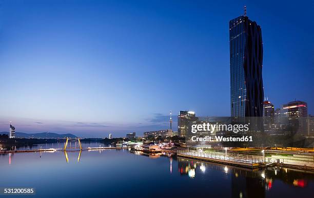 austria, vienna, donau city, danube river and dc tower 1 in the evening - blue hour stock pictures, royalty-free photos & images