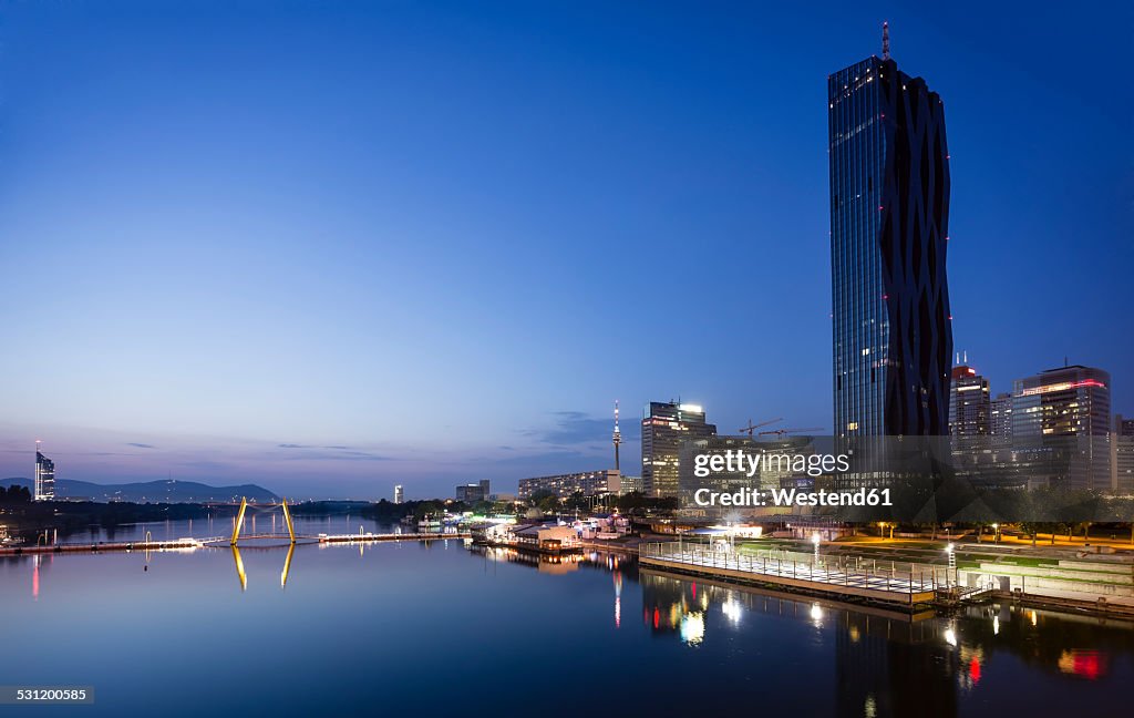 Austria, Vienna, Donau City, Danube River and DC Tower 1 in the evening
