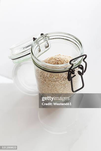 oat bran in preserving jar - bran stock pictures, royalty-free photos & images