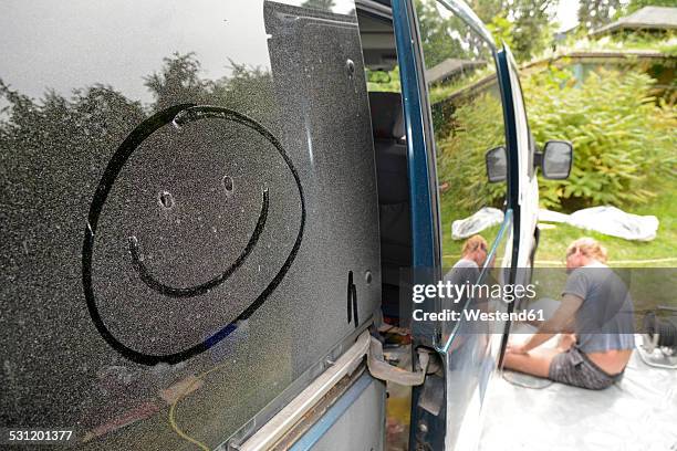 germany, zeuthen, man mending car paint - dirty car stock-fotos und bilder