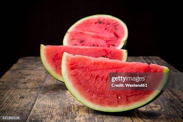 sliced watermelon - watermelon halved stock pictures, royalty-free photos & images