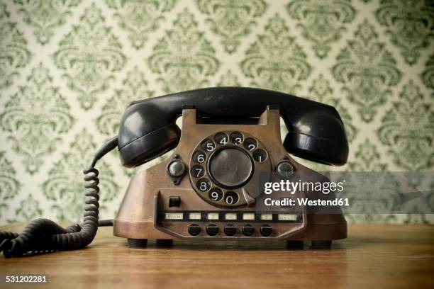 old telephone made of copper - altes telefon stock-fotos und bilder