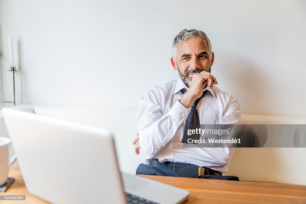 Portrait of businessman at his home office