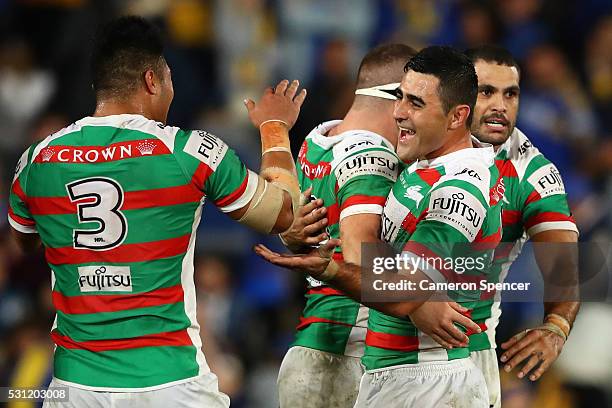 Bryson Goodwin of the Rabbitohs celebrates with team mates after winning the round 10 NRL match between the Parramatta Eels and the South Sydney...