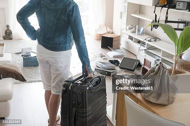 female holidaymaker watching chaos after burglary after comeback in her one-family house - einbruch stock-fotos und bilder