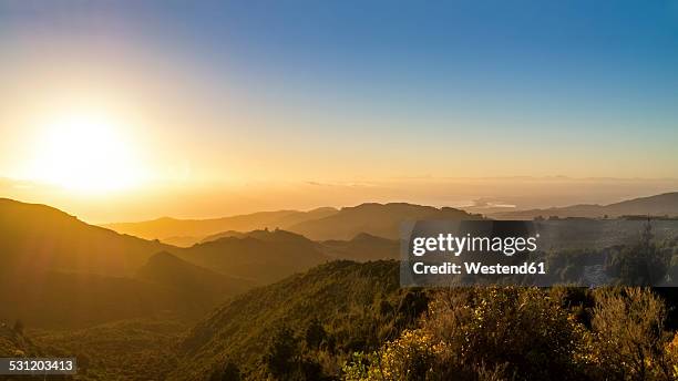 australia, queensland, sunrise above the ocean seen from mountains - australia landscape stock pictures, royalty-free photos & images