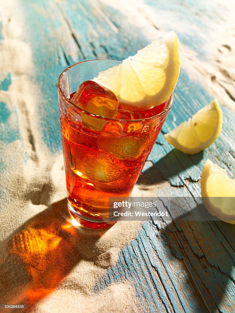 Campari with lemon slice