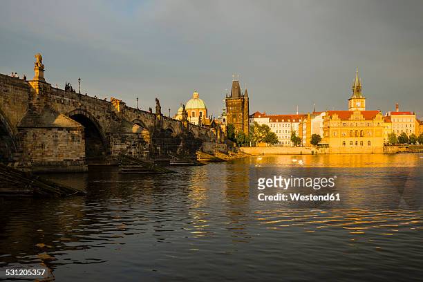czechia, prague, charles bridge, old town bridge tower and bedrich smetana museum in the evening - smetana museum stock pictures, royalty-free photos & images