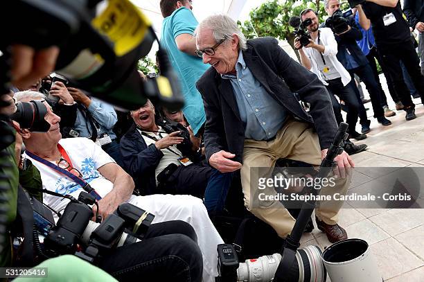 Director Ken Loach speaks with a photographer during the "I, Daniel Black " photocall during the 69th annual Cannes Film Festival at the Palais des...