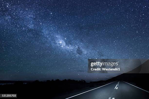 new zealand, south island, starry sky, milkyway at lake pukaki by night - new zealand road stock pictures, royalty-free photos & images