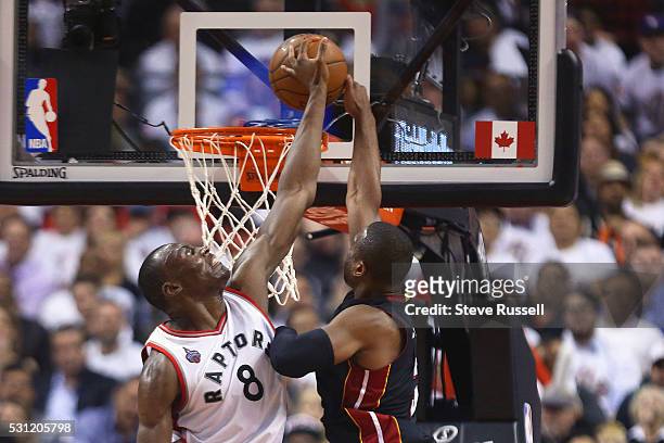 Bismack Biyombo comes up and blocks Dwyane Wade as the Toronto Raptors play the Miami Heat in game five of their Eastern Conference Semifinal at the...