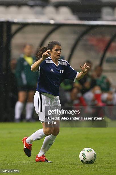 Mia Hamm of FIFA Legends runs with the ball during an exhibition match between FIFA Legends and MexicanAllstars to celebrate the 50th anniversary of...