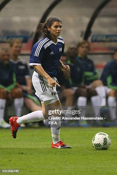 Mia Hamm of FIFA Legends runs with the ball during an exhibition match between FIFA Legends and MexicanAllstars to celebrate the 50th anniversary of...