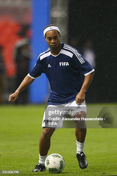 Ronaldinho of FIFA Legends runs with the ball during an exhibition match between FIFA Legends and MexicanAllstars to celebrate the 50th anniversary...