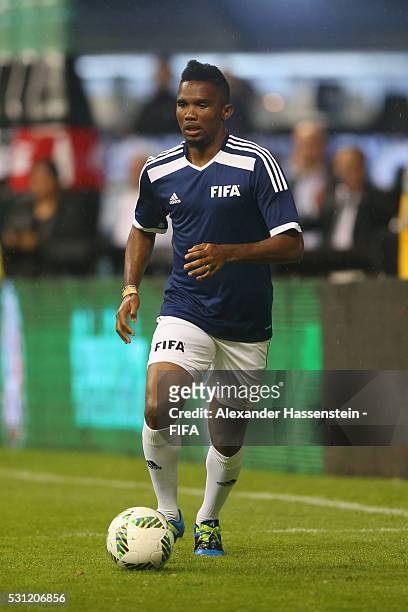 Samuel Etoo of FIFA Legends runs with the ball during an exhibition match between FIFA Legends and MexicanAllstars to celebrate the 50th anniversary...