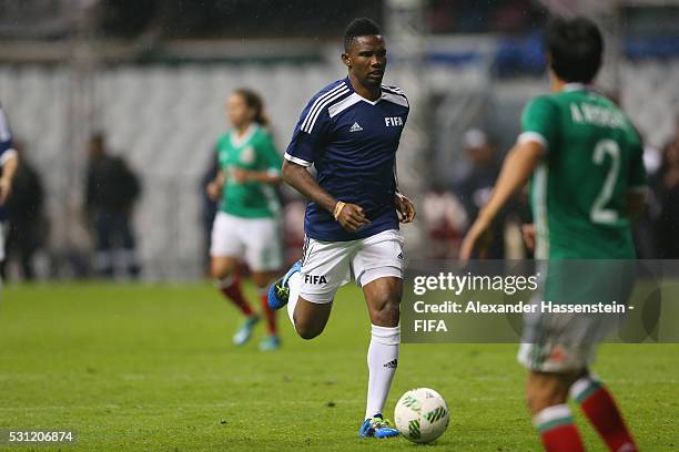 Samuel Etoo of FIFA Legends runs with the ball during an exhibition match between FIFA Legends and MexicanAllstars to celebrate the 50th anniversary...