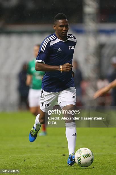 Samuel Etoo of FIFA Legends runs with the ball during an exhibition match between FIFA Legends and MexicanAllstars to celebrate the 50th anniversary...