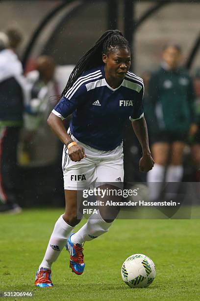 Mercy Akide-Udoh of FIFA Legends runs with the ball during an exhibition match between FIFA Legends and MexicanAllstars to celebrate the 50th...