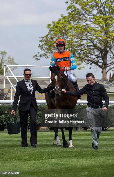 Jockey Robert Havlin and Cunco, the first offspring of the champion racehorse Frankel to appear on a racecourse, are lead back in by traveling head...