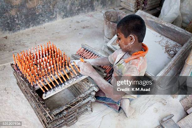 Momen Bangladeshi boy works in a balloon factory at Kamrangir Char in Dhaka, Bangladesh, April 29, 2014. In Bangladesh, at least 7.4 million children...