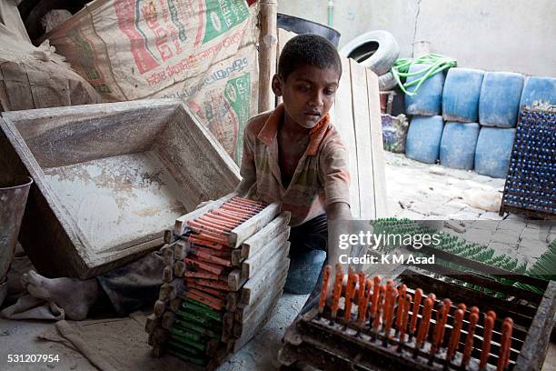 Momen Bangladeshi boy works in a balloon factory at Kamrangir Charin Dhaka, Bangladesh, April 29, 2014. In Bangladesh, at least 7.4 million children...