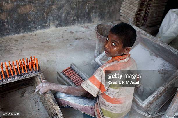 Momen Bangladeshi boy works in a balloon factory at Kamrangir Char in Dhaka, Bangladesh, April 29, 2014. In Bangladesh, at least 7.4 million children...